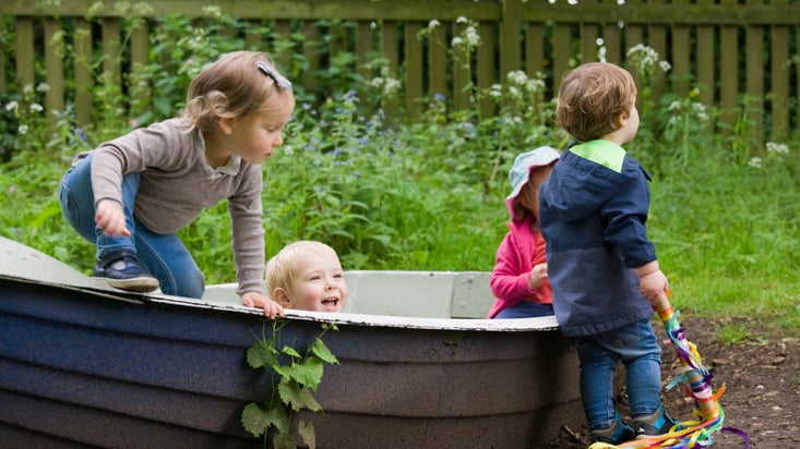 Children playing on a boat at River Wey and Godalming Navigations and Dapdune Wharf, Surrey